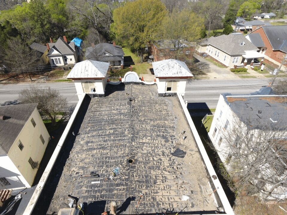 Roof before replacement — showing storm/age damage